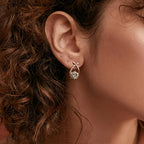 Sole – Orecchini con croce dorata e zircone