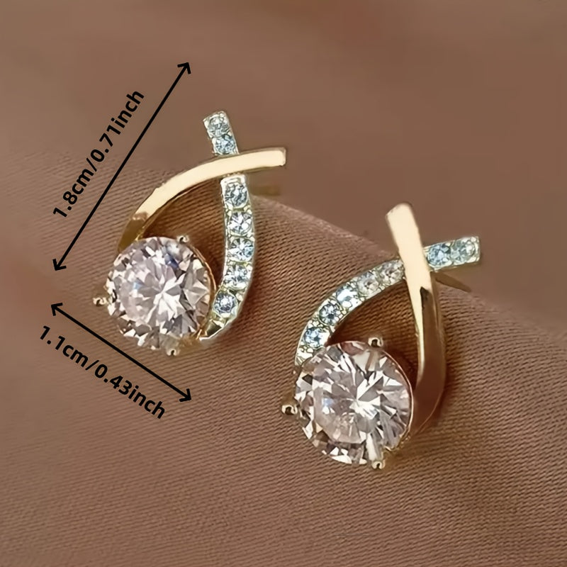 Sole – Orecchini con croce dorata e zircone