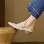 Olga | Mules in pelle sintetica